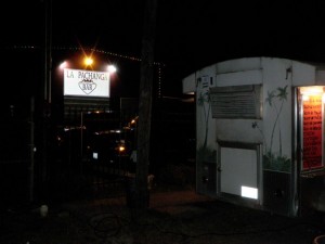 La Pachanga Bar, behind the taco stand. If it's not lit up, it's invisible.